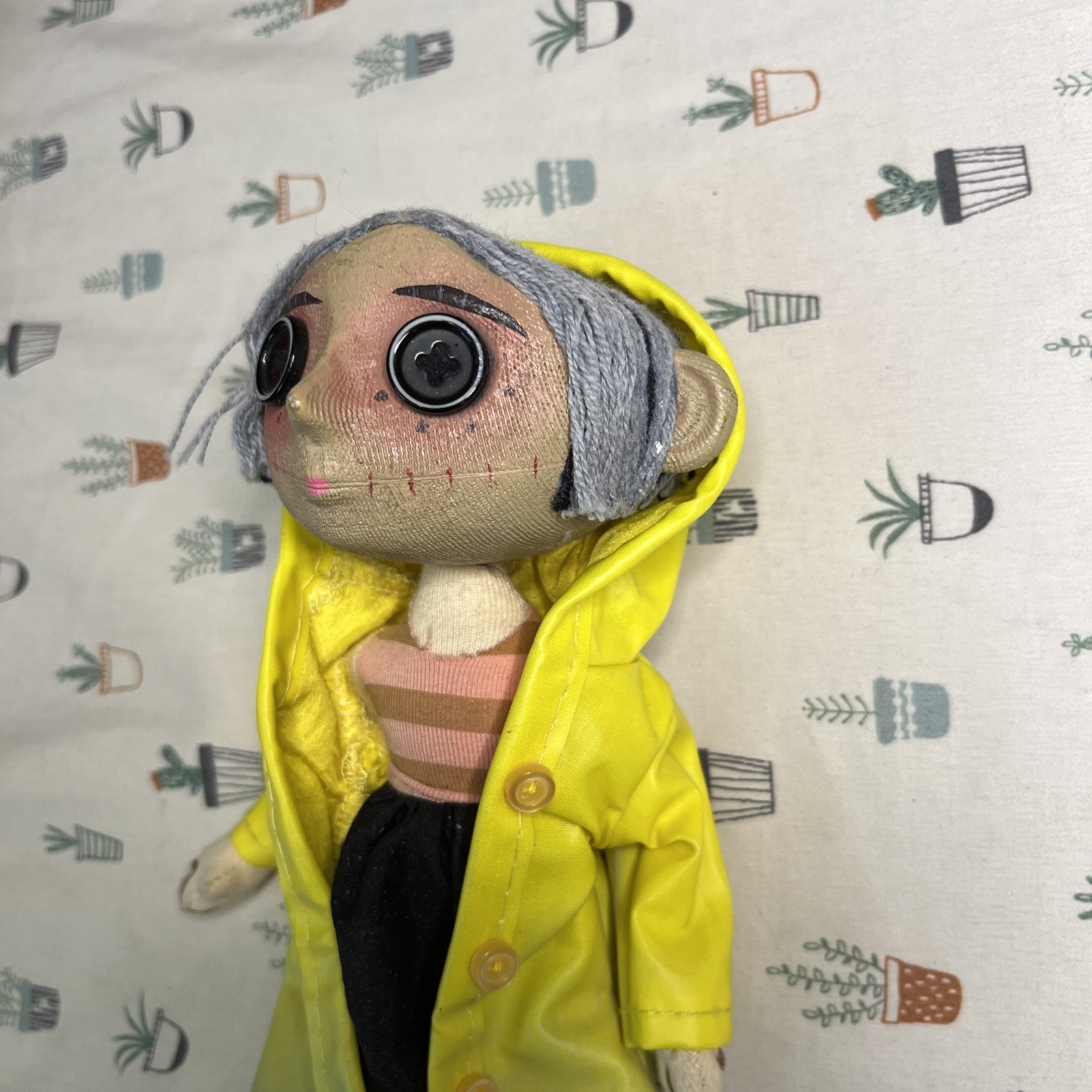 NECA Coraline’s Doll 9” Prop Replica Button Eyes Raincoat Yarn Hair