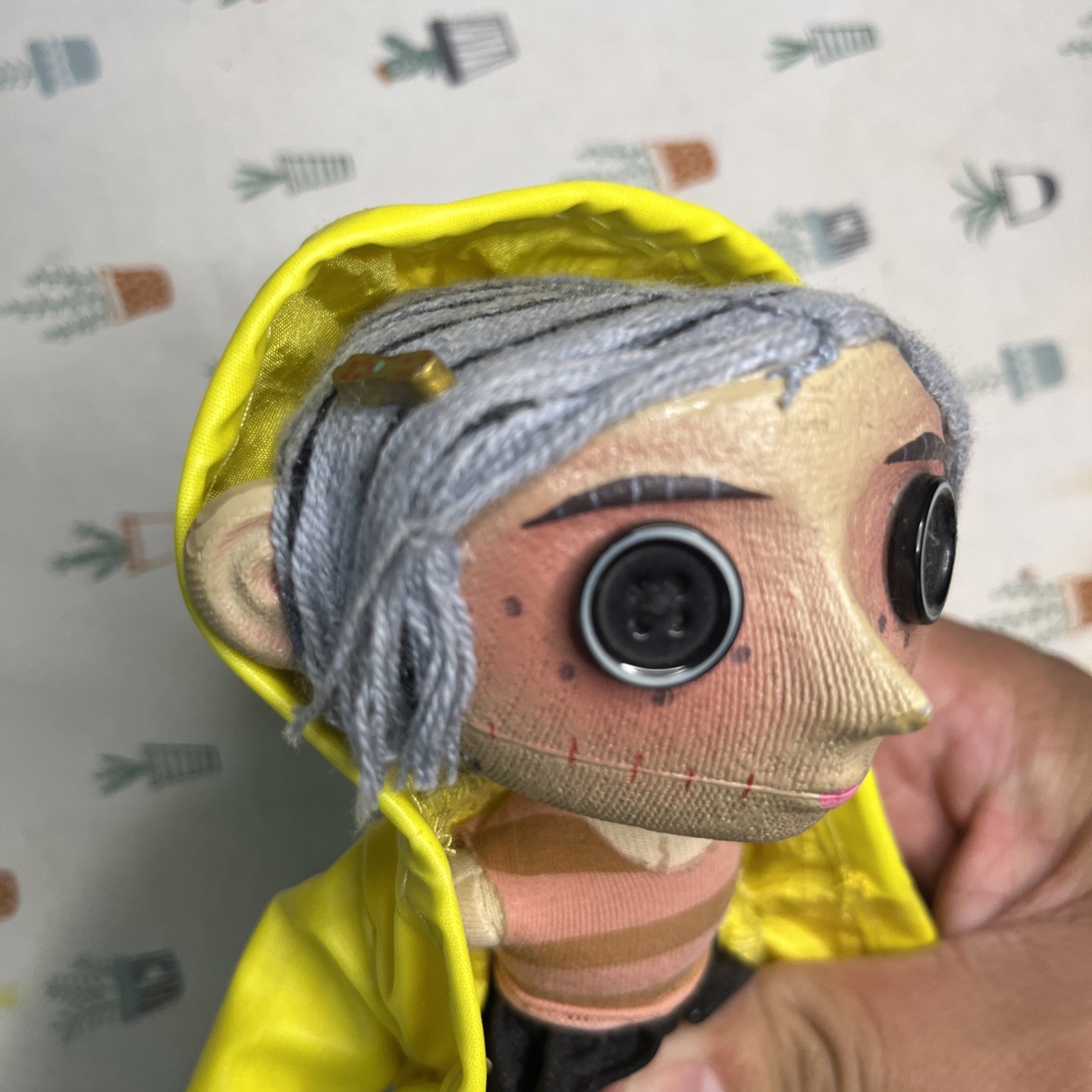 NECA Coraline’s Doll 9” Prop Replica Button Eyes Raincoat Yarn Hair
