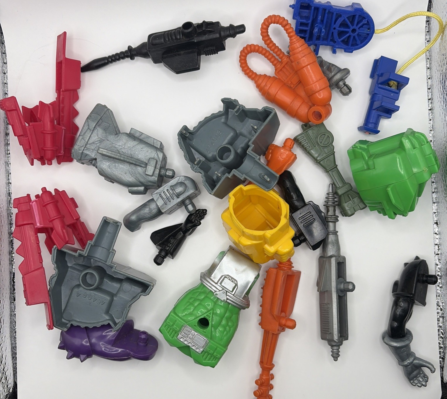Man tech parts lot weapons And Parts**NOT MINT SOME ARE STICKY WEAR
